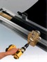 Portable Roller Lacer speeds installation of wire hooks.