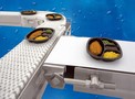 Sanitary Conveyors feature urethane-encased belt.