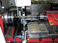 CNC Grinder handles various part features in same machine.