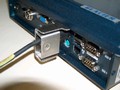 Clamp prevents disconnection of computer cables.