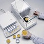 Microbalance provides 31 g capacity and 1 µg readability.