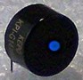 Low-Profile Audio Transducer has right-angle terminals.