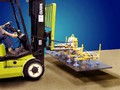Fork Lift Vacuum Attachment secures loads from top.