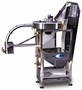 Feeder/Unscrambler orients containers vertically.
