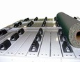 Slat Conveyor handles up to 30 in. long, 4,000 lb rolls.