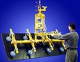 Vacuum Lifter-Tilter lets one person handle 2,000 lb panel.
