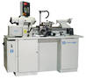 Lathe features electronic servo motor and threading computer.