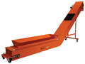 Conveyor efficiently handles light, fluffy fiber materials.