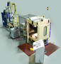 Robotic Grit-Blast Machine performs precise surface preparation.