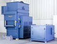 Vertical Conveyor Oven preheats baskets of steel parts.