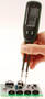 Handheld Digital Meter identifies, tests electronic components.