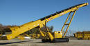 Portable Stacking Conveyor has track-mounted design.