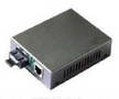 Media Converter turns Ethernet signal via CAT5 to optical fiber.