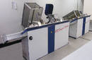 In-Line Sewing Machine stitches tabloid size photo books.