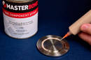 One-Part Epoxy  adheres to metal and ceramics.