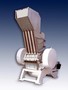Granulator reduces size of rubber bales.