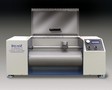 DIN Abrader tests 5/8 in. dia samples.