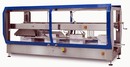 Case Sealer runs both tape and hot melt adhesive.