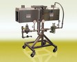 Manually-Operated Shrink Tunnel operates up to 100 cpm.