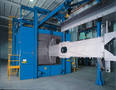 Blast Cleaner descales and profiles plate/structural steel.