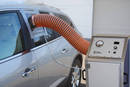 Tester performs static body air leakage tests on vehicles.