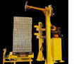 Robotic Unwrapper removes stretch wrap from pallet loads.