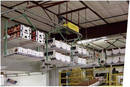 
Multi Size Boxes Transported Overhead on Custom Carriers

