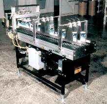 Conveyors interface with wrapping machines.