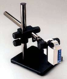 Adjustable Stand holds video microscope inspection systems.