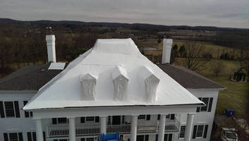 Shrink Wrap Used to Cover Mansion Roof
