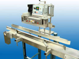 Vertical Conveyorized Band Sealer for handle pouches with zippers.