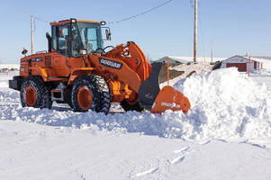 Snow Pusher Attachments mount to wheel loader buckets.