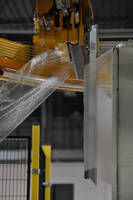 Seaming Device secures stretch wrap film tails.