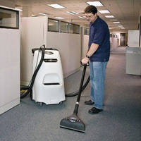 Portable Carpet Extractor features upright design.