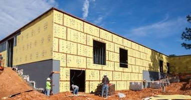 Sheathing with WRB-AB accelerates exterior wall installation.