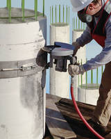 Pneumatic Saw precisely trims concrete pilings.