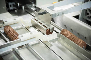 Packaging System handles biscuits and crackers in slug packs.