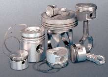 Piston Ring Assembly System suits large diesel pistons.