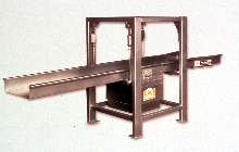 Conveyor moves fragile products with sliding motion.