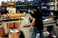 Slitter cuts large rolls of material down to size.