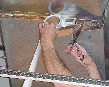 Shears cut duct sealant tapes.