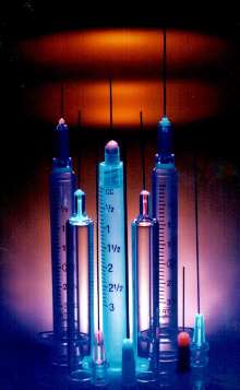 Acrylic Adhesive bonds needles and syringes.