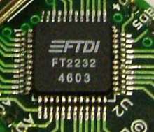 Integrated Circuit accesses 2 serial or parallel ports.