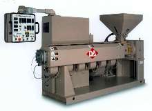 Thermoplastic Extruder features swing-arm controls.