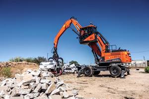 DX210WMH-5 Wheel Material Handler features abrasion-resistant steel grapple.