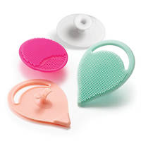 Silicone Facial Cleansing Pads feature suction cup handle.