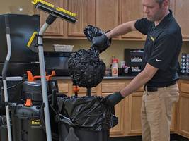 New Trash Compacting System Vacuums Air from Trash Cans