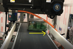 New Plastic Belt Conveyors Utilize Servo Driven Overhead Transfer Device