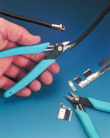 Scissor cuts cable jacketing and light metal.