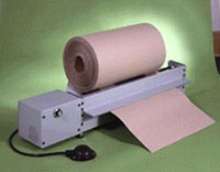 Feeder dispenses rolls of dunnage and wrapping materials.